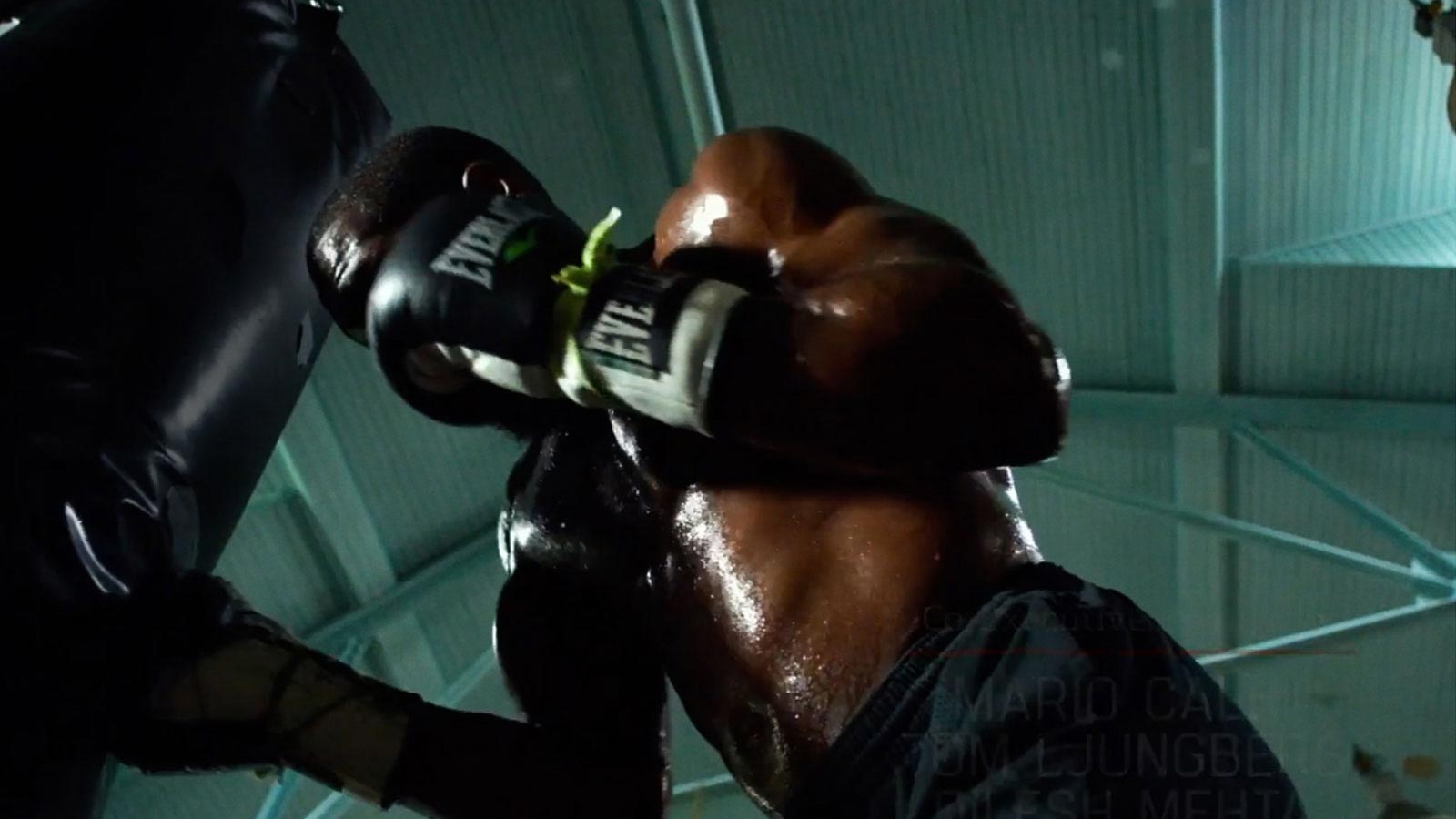 Background image of boxer punching a punching bag